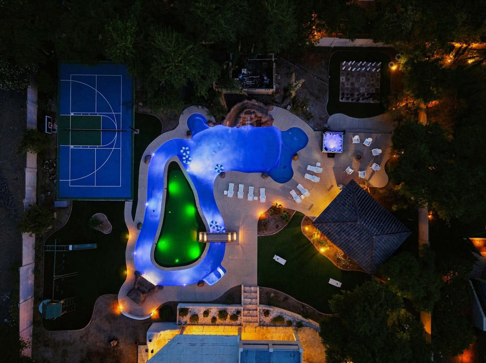 Straight-down aerial photo showing the full S-curve shape of the lazy river and putting-green island